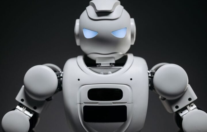 Detailed studio shot of a modern robotic toy with a dark background, showcasing technological design.